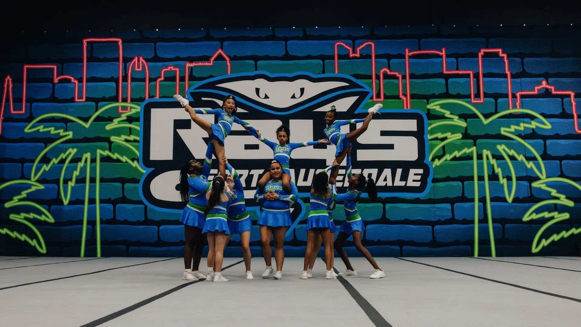 The full Stingray Allstars Fort Lauderdale program in front of the Rays mural wall